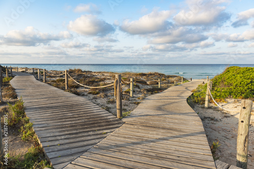 Wooden walkways to the beach of Formentera. Spain photo