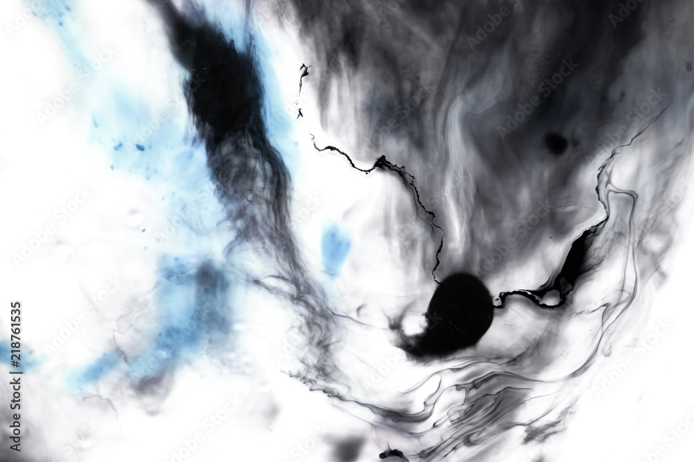 Abstract ink background. Moving liquid paint in water. Black and blue casual movement