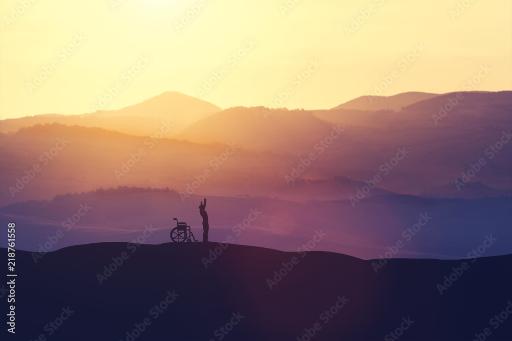 Happy man getting up from a wheelchair