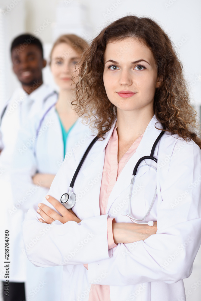 Happy doctor woman with medical staff at the hospital Happy doctor woman with medical staff at the hospital