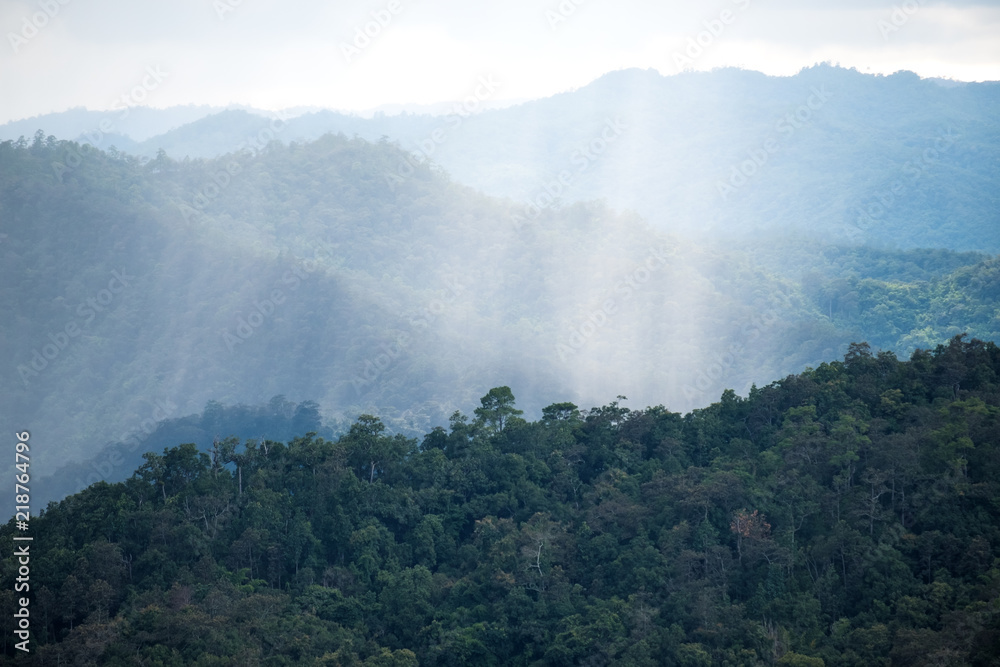 Landscape image of greenery mountain hills while it's raining Landscape image of greenery mountain hills while it's raining