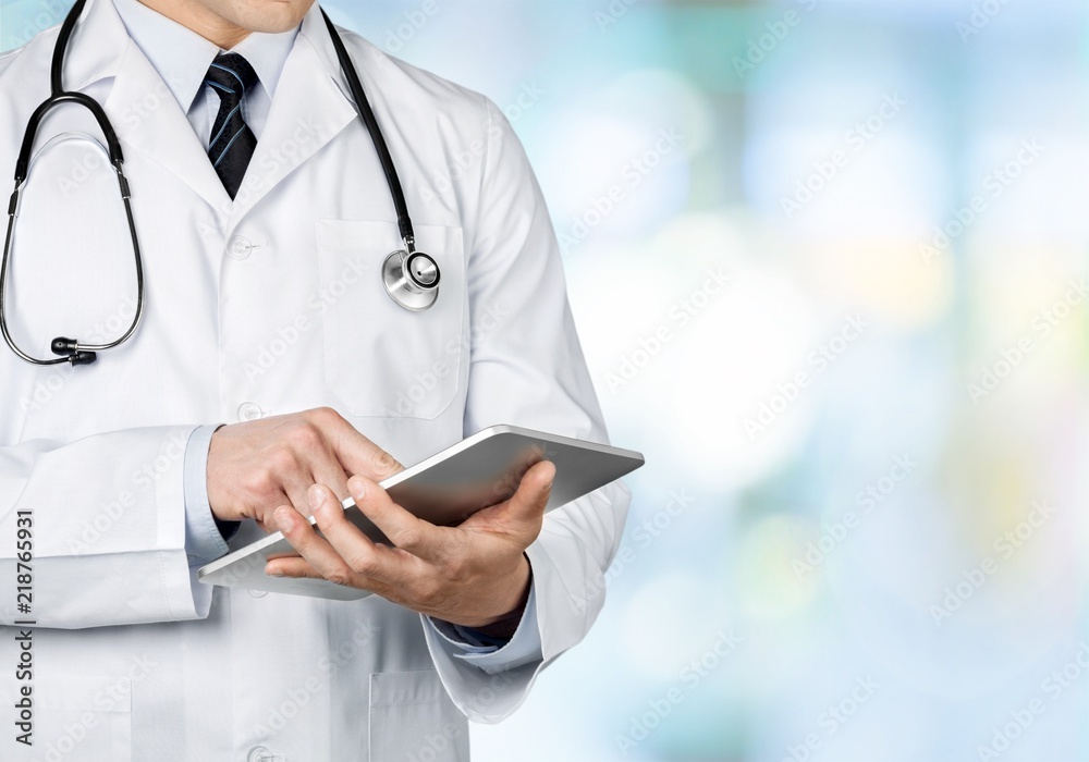 Close-up Doctor at hospital working with tablet pc Close-up Doctor at hospital working with tablet pc