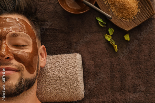 Young man with face mask on...