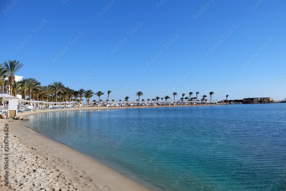 View of sea beach at tropical resort on sunny day View of sea beach at tropical resort on sunny day
