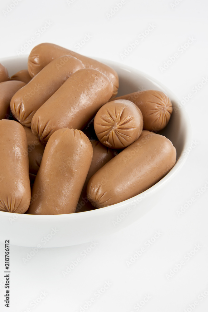 Fototapeta premium Raw appetizer sausages served in a bowl