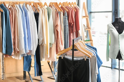 Racks with women clothes in...