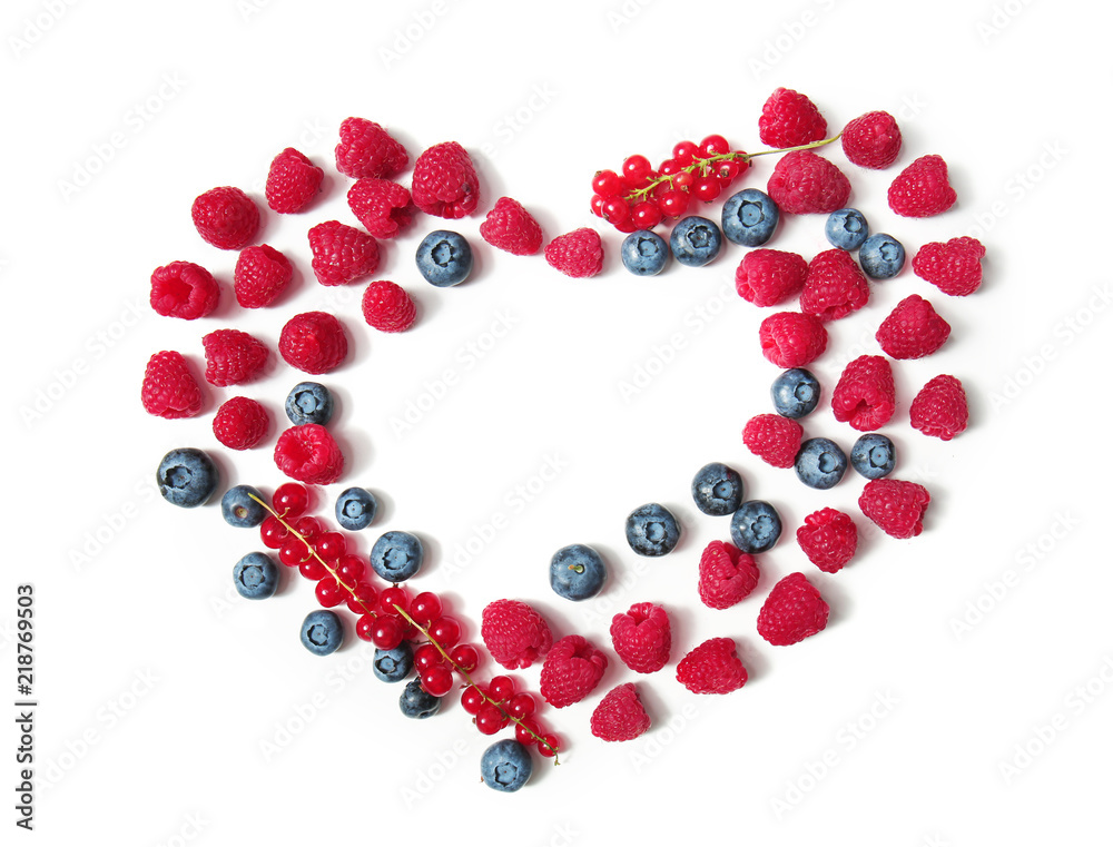 Heart made of delicious ripe berries on white background Heart made of delicious ripe berries on white background