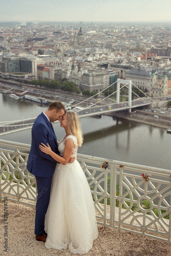 young happy romantic wedding couple outdoors in city