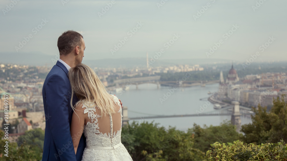 young happy romantic wedding couple outdoors in city