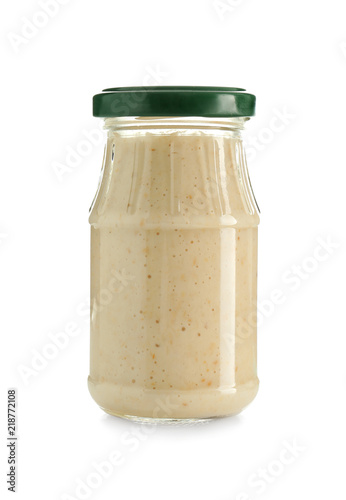 Jar with tasty sauce on white background