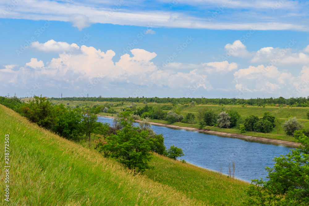 View on the irrigation canal on summer - obrazy, fototapety, plakaty 