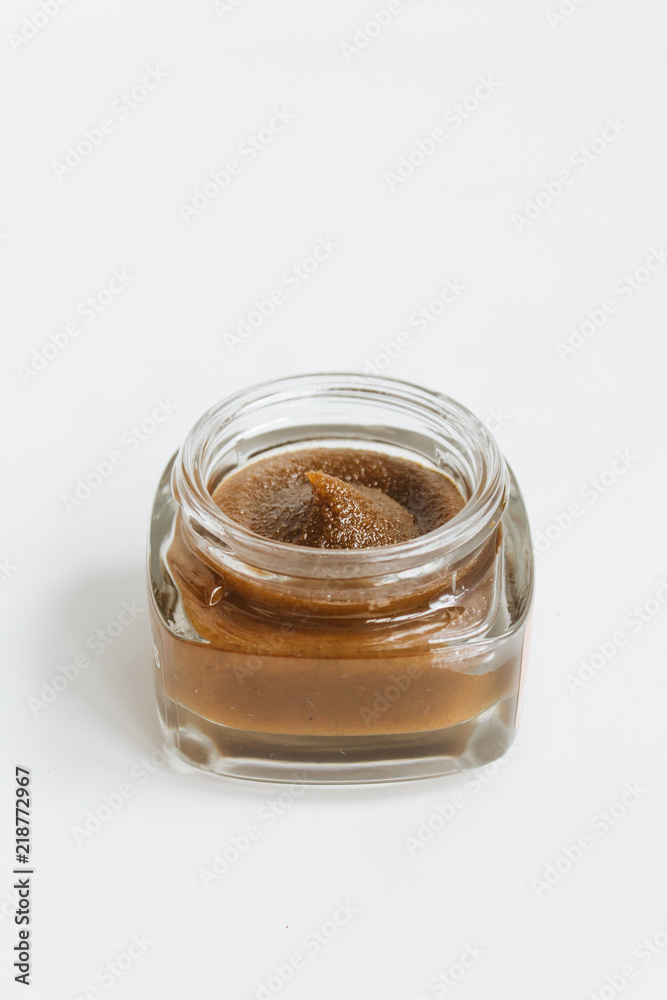 Chocolate cream in small jar on white background Chocolate cream in small jar on white background