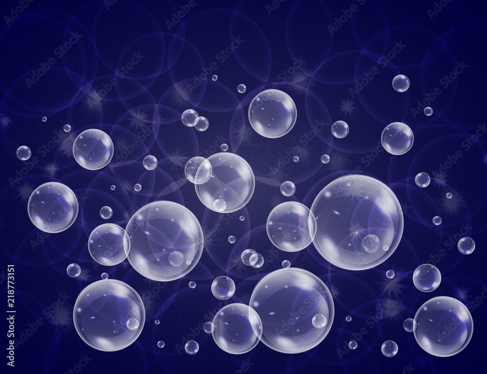 Realistic soap bubbles with rainbow reflection set isolated on the blue sparkling background.