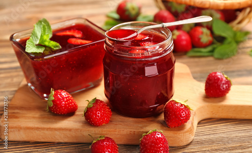 Wallpaper Mural Glass jar and bowl with delicious strawberry jam on wooden table Torontodigital.ca