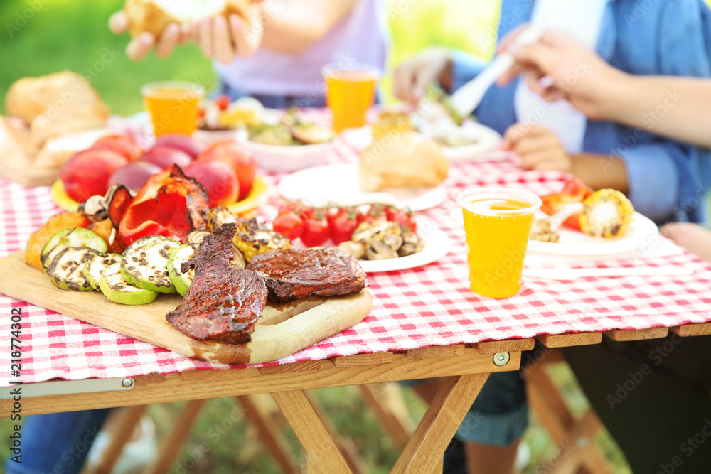 Family having picnic on summer day, closeup