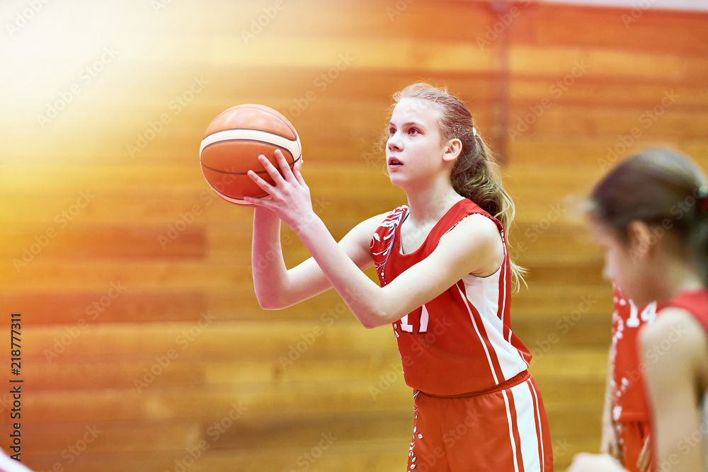 Girl basketball player throws ball in game Stock Photo Adobe Stock