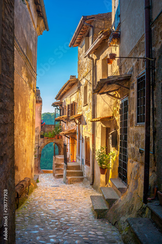 A street in a beautiful small medieval village in Tuscany at sunset. Italy. Europe