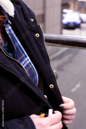 Plaid Shirt and warm winter jacket on the woman's shoulders