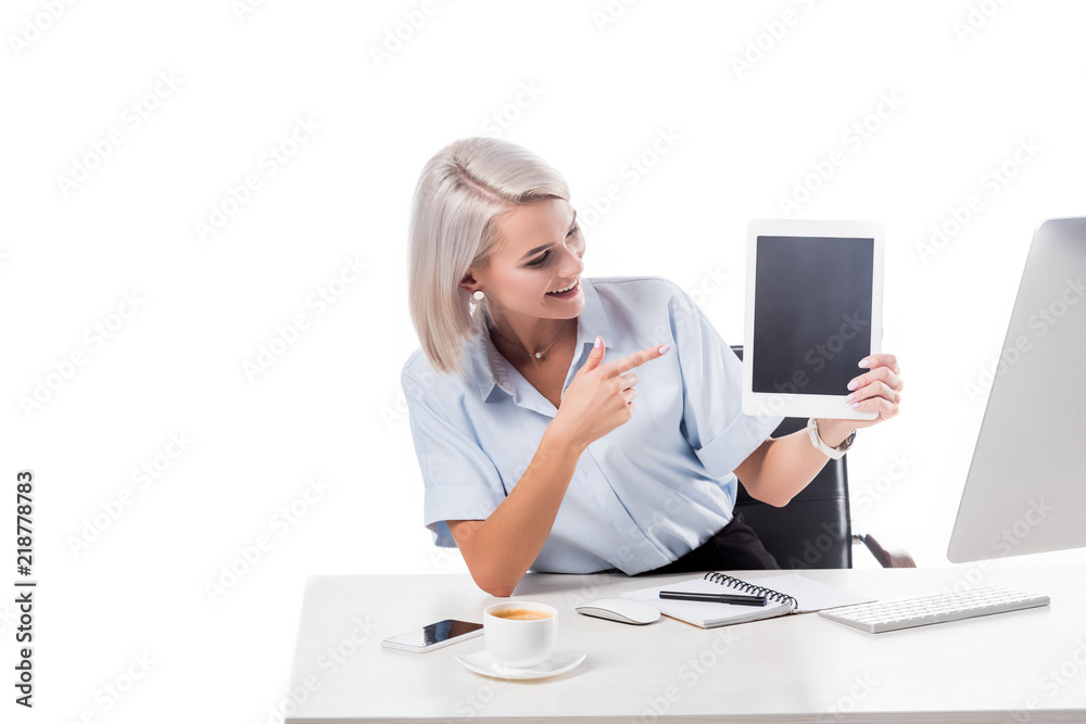 portrait of smiling businesswoman pointing at tablet with blank screen at workplace isolated on white portrait of smiling businesswoman pointing at tablet with blank screen at workplace isolated on white