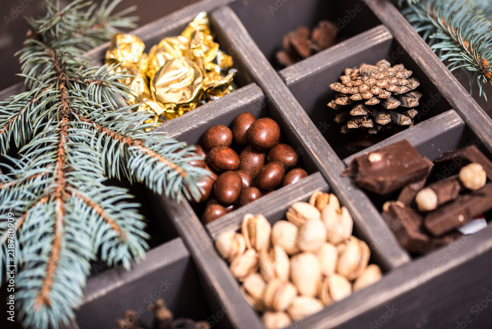 Decorative wooden box with hazelnuts,mandarins and gifts. Decorative wooden box with hazelnuts,mandarins and gifts.