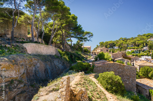 Sunny view of fortress Tossa de Mar at the coast of Mediterranean sea, Girona province, Spain.