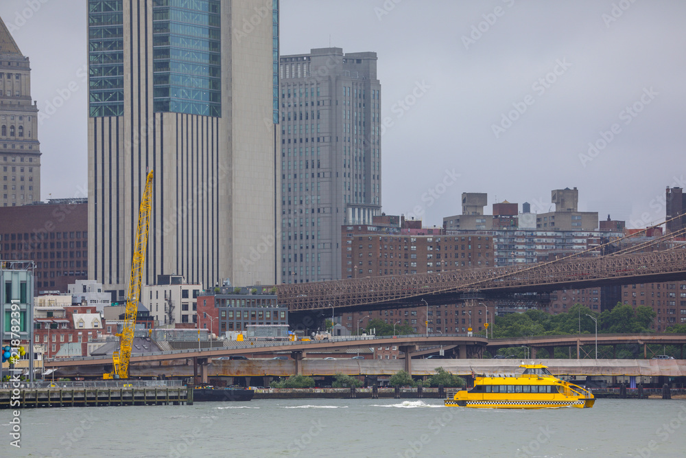 Image of a New York City scene with water taxi in the river Stock Photo ...