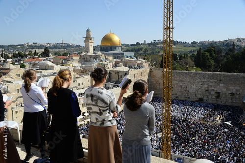 Religious Jews pray at the Western Wall in Jerusalem. Prayer of the Coens in honor of the Jewish holiday Pesach