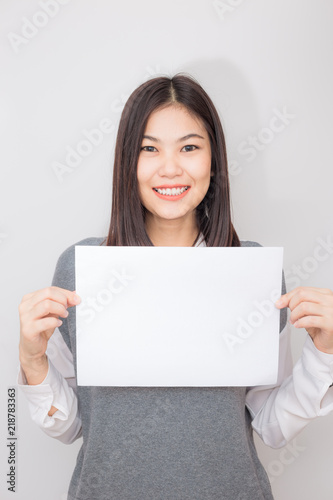 Beautiful asian women hold white blank paper advertising