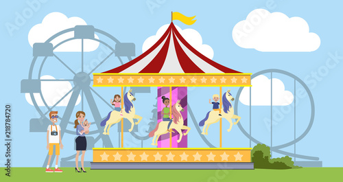 Children having fun on the merry go round