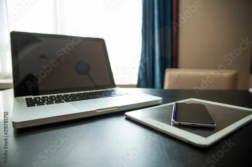 modern computer gadgets - laptop, tablet and phone close up, retro toned