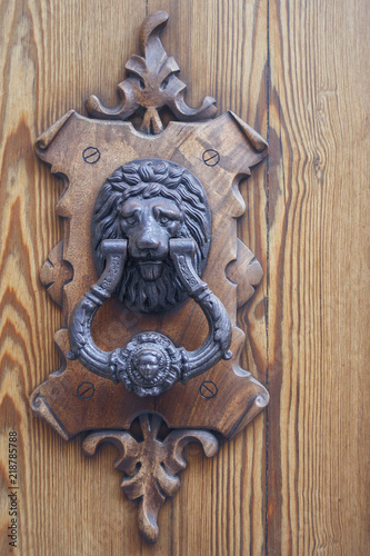 beautiful door handle on wooden door close-up
