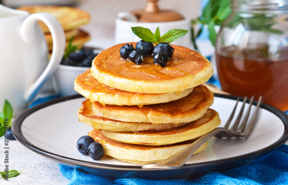 Homemade vanilla punkcakes with syrup and blueberries for breakfast. Good morning! Homemade vanilla punkcakes with syrup and blueberries for breakfast. Good morning!