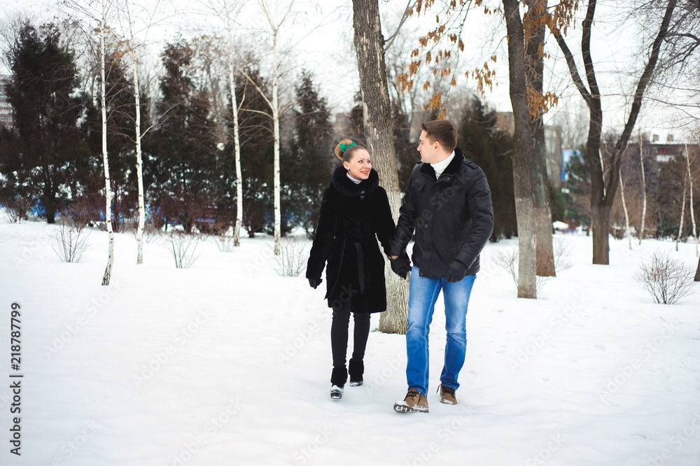 couple in love in the winter forest couple in love in the winter forest