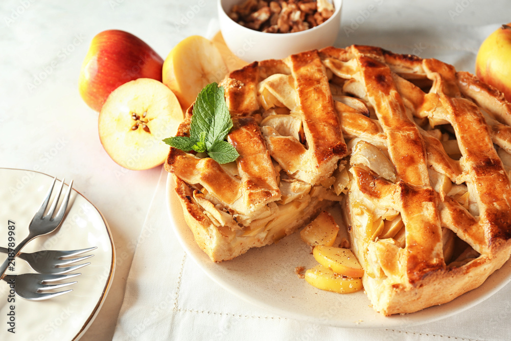 Plate with delicious apple pie on white table, closeup Plate with delicious apple pie on white table, closeup
