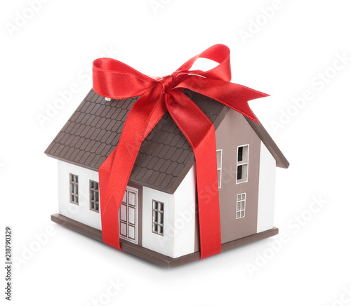 House model with red ribbon...
