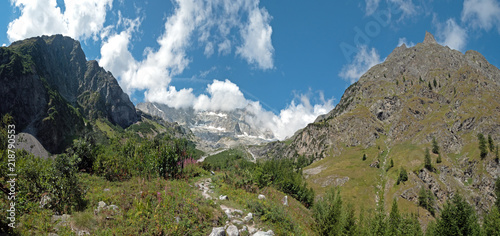 Views showing High mountains, rivers, forests, valleys and the alpine landscape of La Fouly in the Canton of Valais, Switzerland. photo