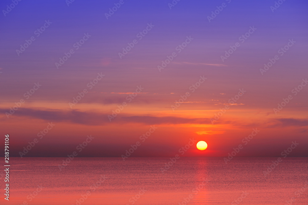 eautiful red-purple sunset at sea. Evening calm.