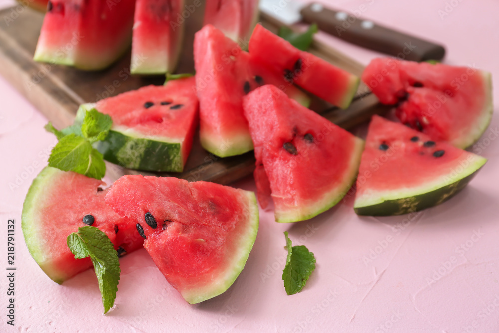 Slices of ripe watermelon on color table Slices of ripe watermelon on color table