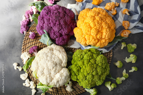 Different cauliflower cabbages on table