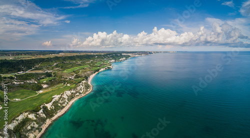 Aerial drone view of a golf course next to the cliffs and Black sea. Golfing fields landscape