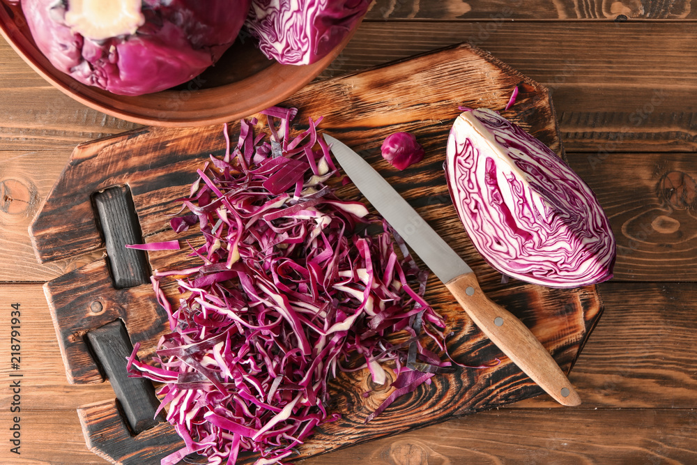 Cut red cabbage on wooden board