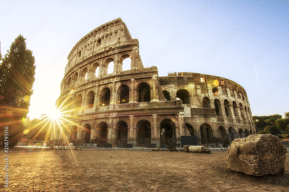 Naklejka premium Colosseum in Rome at the Sunrise Time - Colosseum is one of the main travel attractions - The Main symbol of Rome