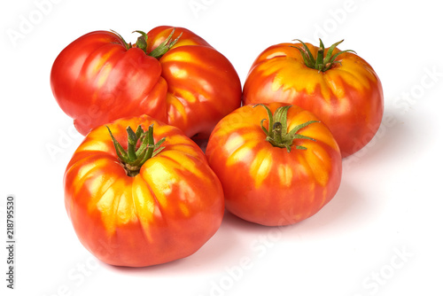 Fresh colorful sweet rustic tomatoes, isolated on white background.