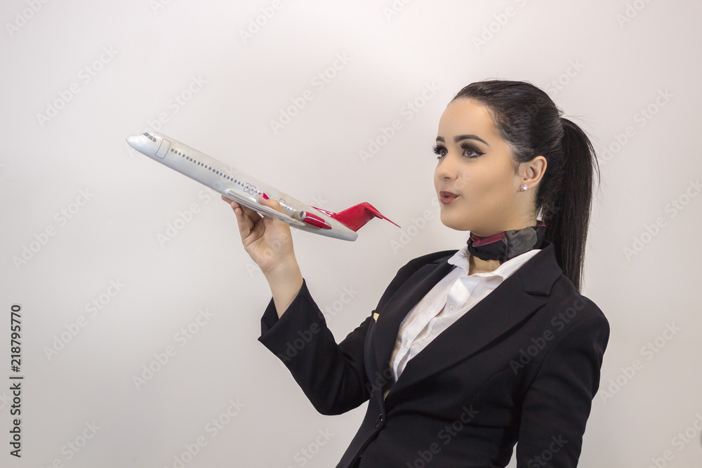 Beautiful stewardess. Studio shot with fly attendant woman. Beautiful stewardess. Studio shot with fly attendant woman.