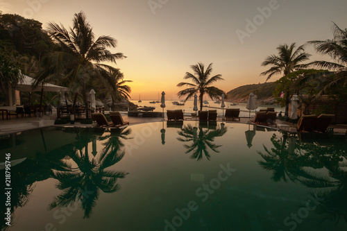 Sunset on Raya Island, Thailand with the pool in the foreground and the beatiful seaview in the backgorund. © Carl
