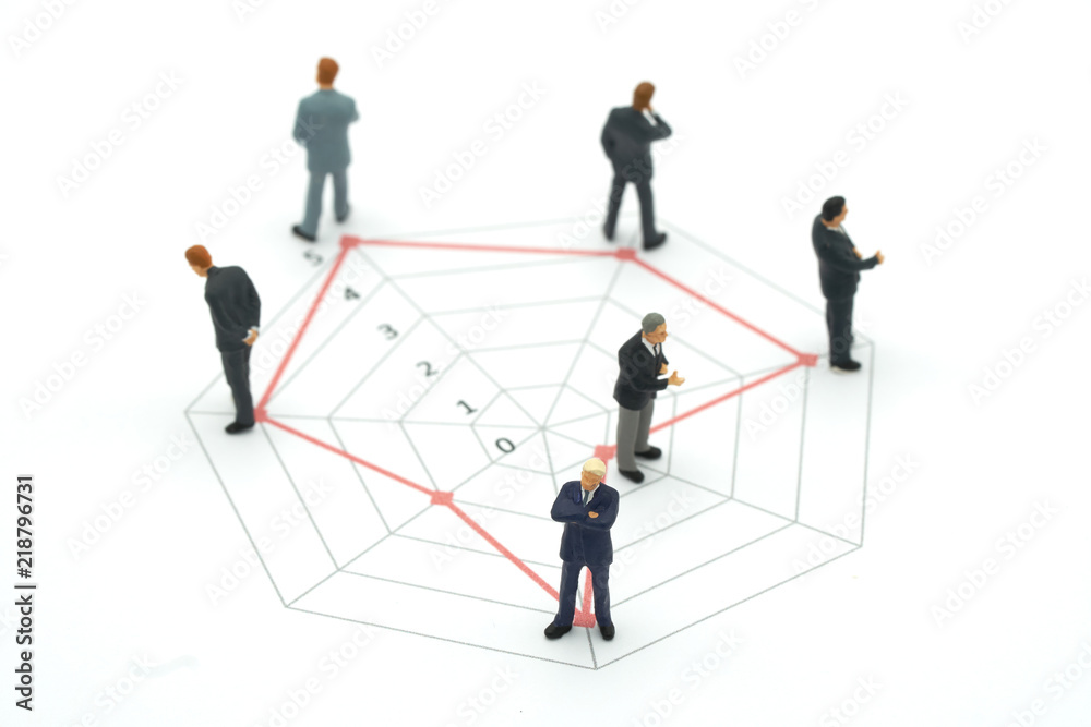 Miniature people businessmen standing on a Circle graphs of various skill levels. The concept used in selecting personnel to participate in the organization. with copy space.