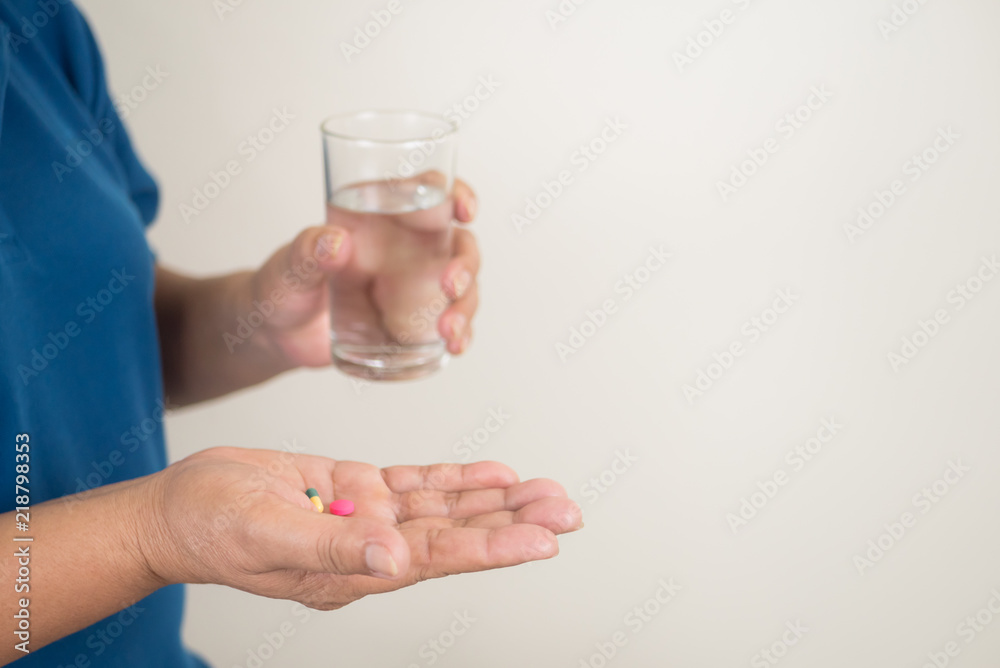 senior woman with many pills in her hand. senior woman with many pills in her hand.