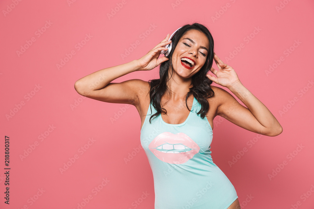 Portrait of a satisfied young woman in swimsuit