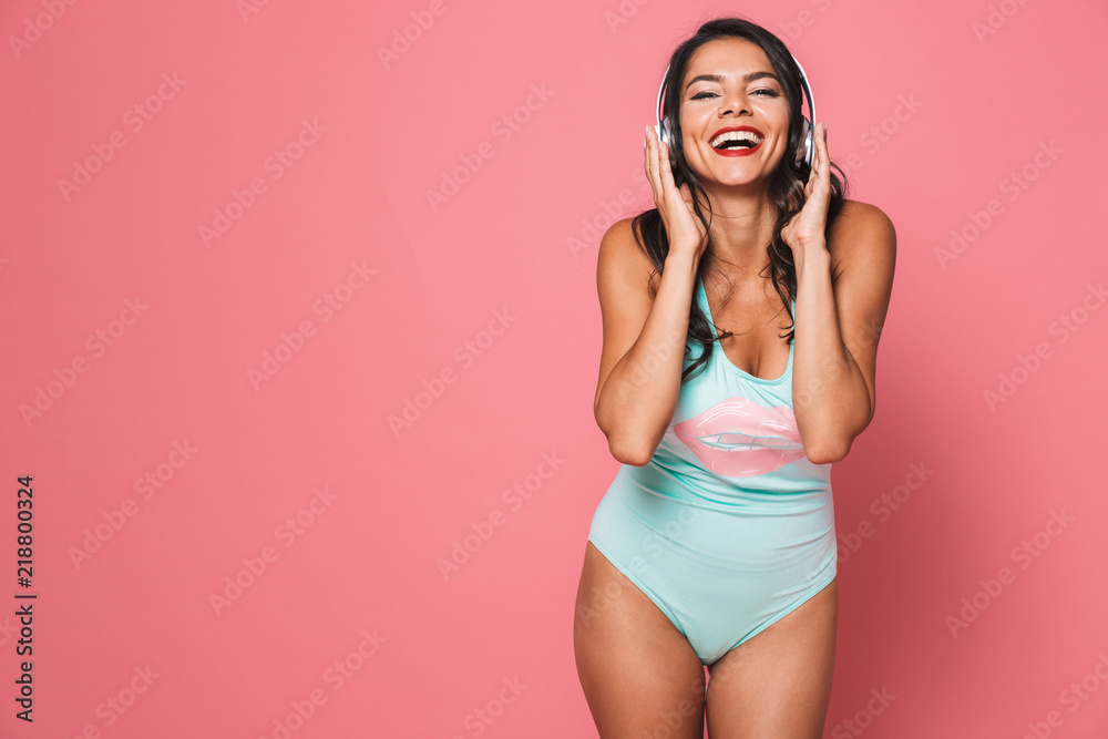 Fototapeta premium Portrait of a cheery young woman in swimsuit