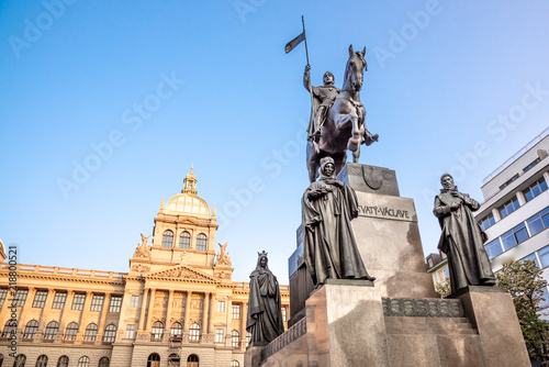 The bronze equestrian statue of St Wenceslas at the Wenceslas Square with historical Neorenaissance building of National Museum in Prague, Czech Republic. photo